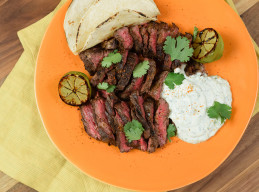 Hanger Steak Tacos with Cilantro-Lime Crema and Charred Limes