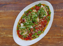 Olive Oil Poached Cod with Olives, Capers, Caramelized Shallots, Pine Nuts and Tomato